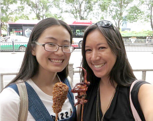 Two LTL students trying out the local street food in Chengde