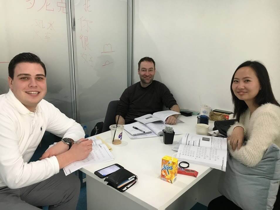 Henri, his classmate, and his teacher in a classroom at LTL Shanghai