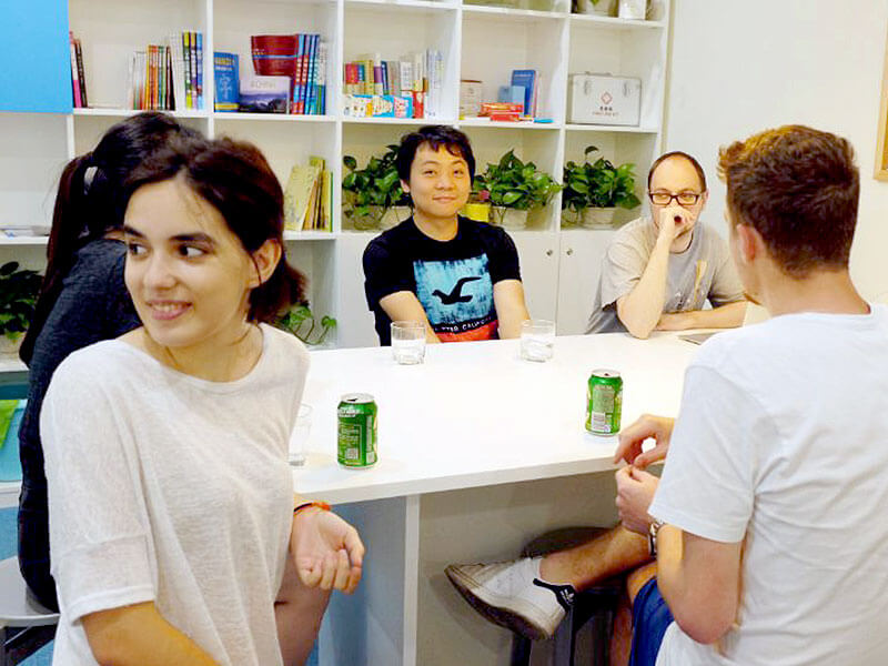 Students sitting around a table at LTL Shanghai